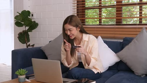 Woman Shopping Online With Credit Card at Home