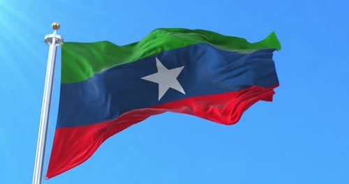 Realistic Flag Waving in Wind Against Clear Blue Sky