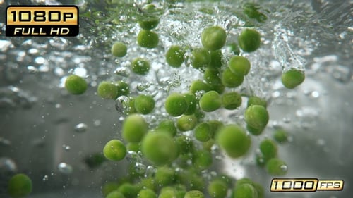 Green Peas Falling into Pot - Underwater View