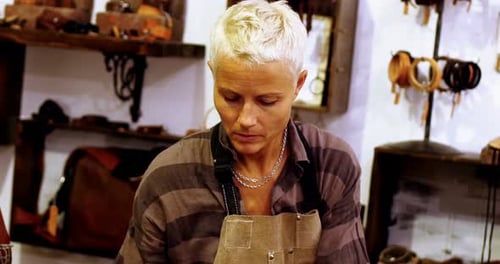 Woman Making Leather Goods in Workshop