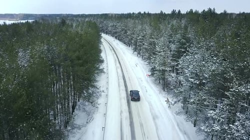 Car Driving on a Winter Country Road