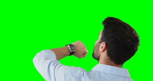Man Interacting with Smartwatch on Green Screen