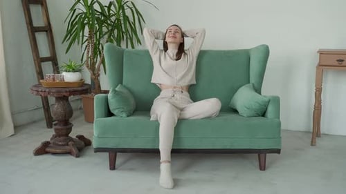 Woman Relaxing on Couch in Lounge Set