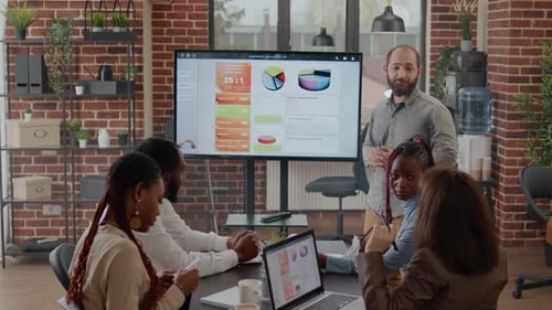 Diverse Team Attends a Business Analytics Meeting