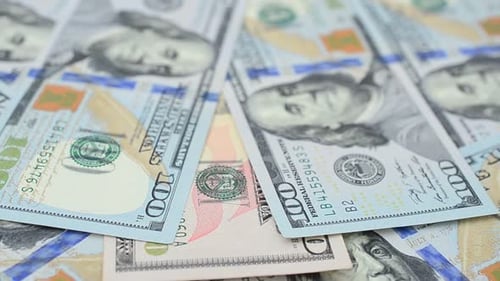Hundred Dollar Bills Piled Close-Up