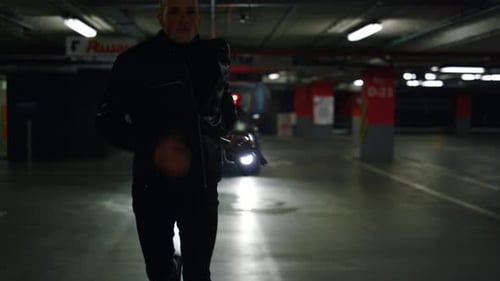 Man Runs in Parking Garage Holding Gun