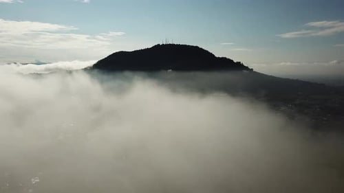 Aerial reveal the small town at Bukit Mertajam by fly over the white cloud