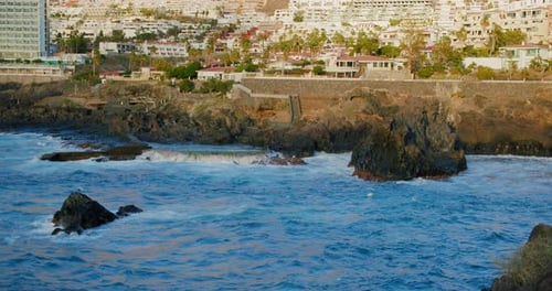 Cityscape on the Black Ocean Rocks Stormy Big Waves