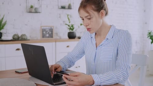 Young Woman Shopping Online with Laptop