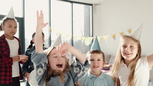 Excited Children Celebrate at Birthday Party
