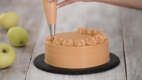 Decorating a Caramel Cake with Frosting Rosettes