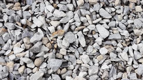 Texture of Small Black Rubble Lying on the Ground Closeup Slow Motion