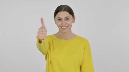 Young Woman Gives Thumbs Up Gesture