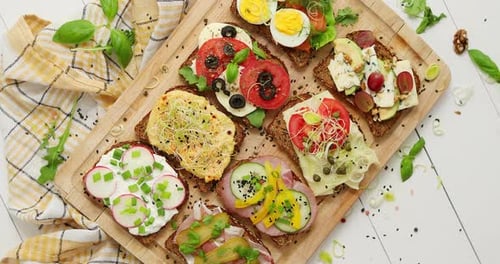 Delicious Open-Faced Sandwiches on Wooden Board
