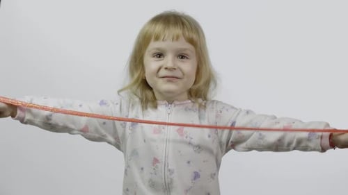 Kid Playing with Hand Made Toy Slime. Child Having Fun Making Red Slime