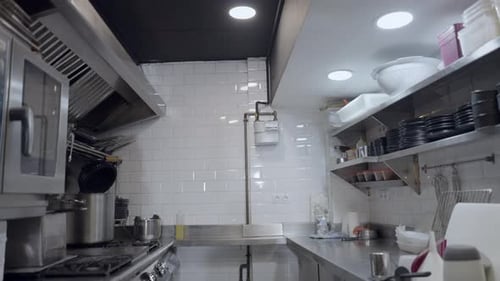 Slow Pushout of Counters and Stoves in Metallic Restaurant Kitchen