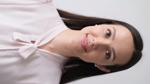 Smiling Woman in Pink Blouse Posing