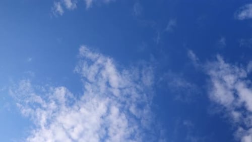 Blue Sky with White Clouds Drifting Slowly