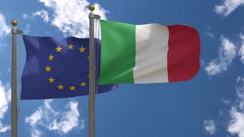 Italy and European Union Flags Waving Against Blue Sky