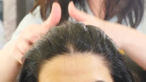 Woman Getting a Scalp Massage at Hair Salon