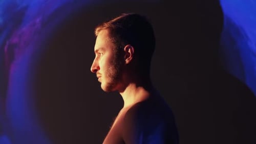 Young Adult Man Profile in Blue Light
