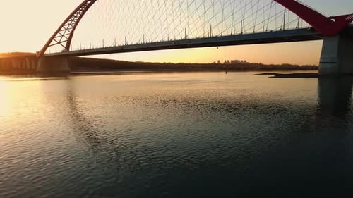A Large Road Bridge Against the Backdrop of the Sunset Sun
