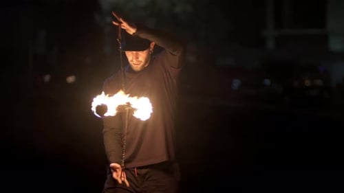 Man Performs Fire Dance at Night