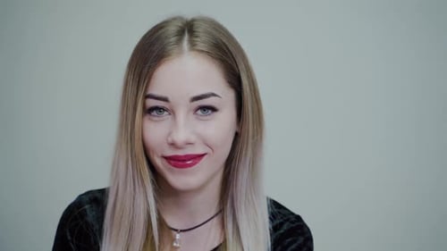Smiling Blonde Woman Looking at the Camera