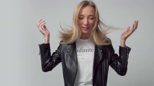 Beauty 30s Blonde Woman in Studio with Blowing Hair