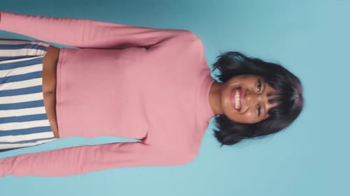Woman Smiling and Posing in Pink Shirt