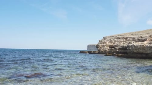 Seascape on a Sunny Clear Day and a Rocky Coastline.