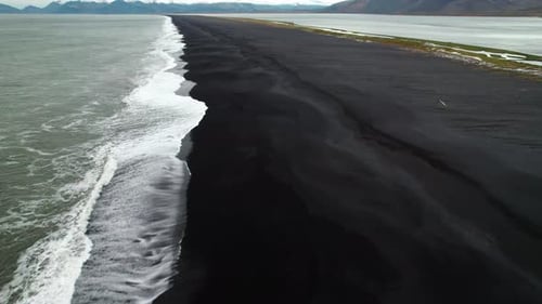 Drone Over Black Sand Beach And Tide Near Estrahorn Mountain