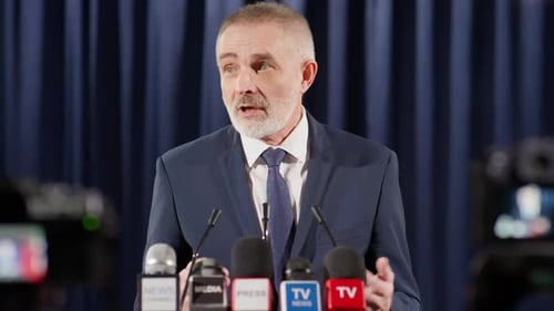 Man Speaking at Press Conference