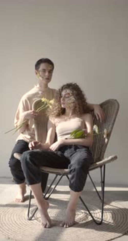 Tendet Young Couple with Floral Make Up Pose in Studio
