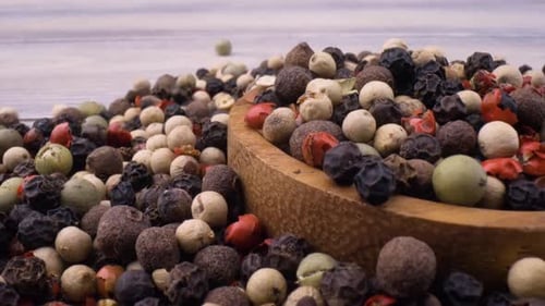 Colorful Peppercorns in Wooden Bowl, Close Up