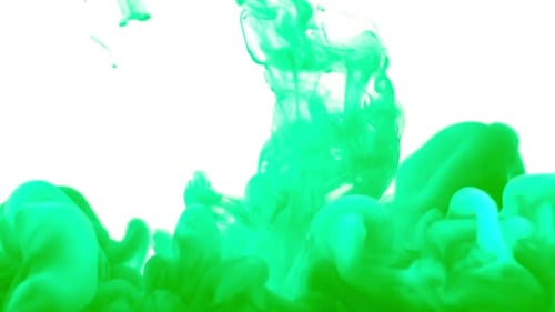Green Ink sprayed into water as red ink follows