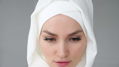 Beautiful Woman with Long Eyelashes Smiling at Camera