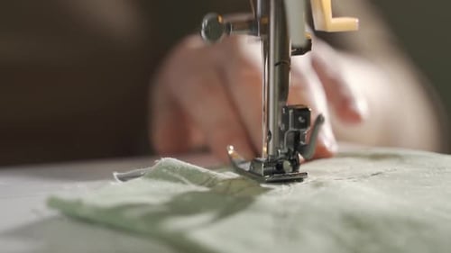 Sewing Machine Stitches Green Fabric Close Up
