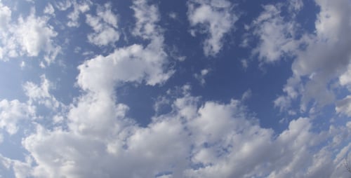 Clouds Moving Rapidly in a Bright Blue Sky