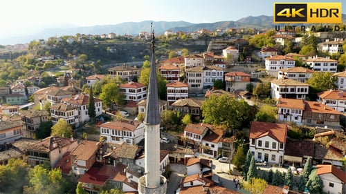 Scenic Aerial View of Red-Roofed Town and Mosque