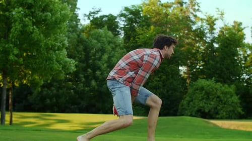 Playful Family Catch Game in Summer Park