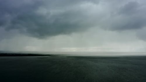 Aerial View of Clouds with Heavy Rain and an Approaching Storm on the Sea