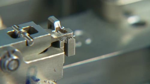 Automated Machine Attaching Materials in Factory Setting