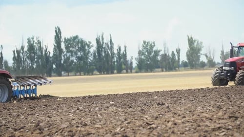 Tractor Plows a Field