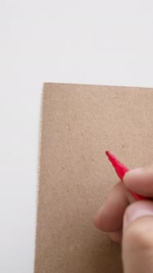 Man's Hand Writes the Number Four with a Felttip Pen