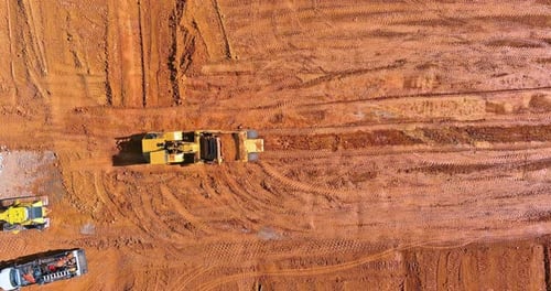 Leveling the Landscape for Construction Site with Excavator Doing Moving Soil