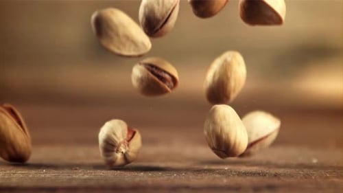 Pistachios Fall on the Table