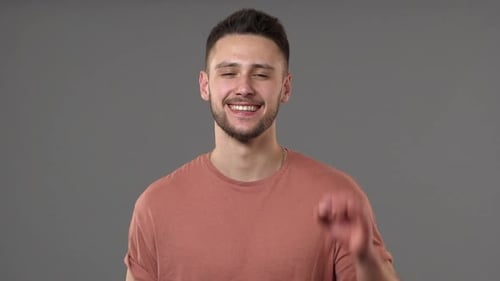 Young Adult Man Smiling OK Gesture