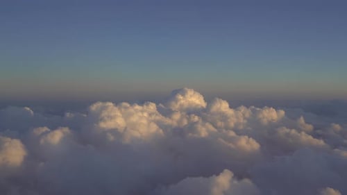 Aerial View of Golden Clouds at Sunset