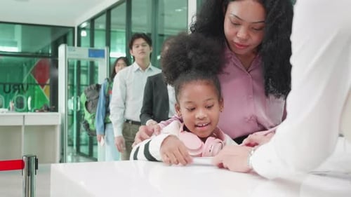 Africa America mother and her daughter send passports to airline staff
